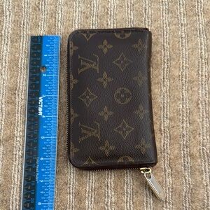 Louis Vuitton Monogram Leather Wallet. Color: Brown